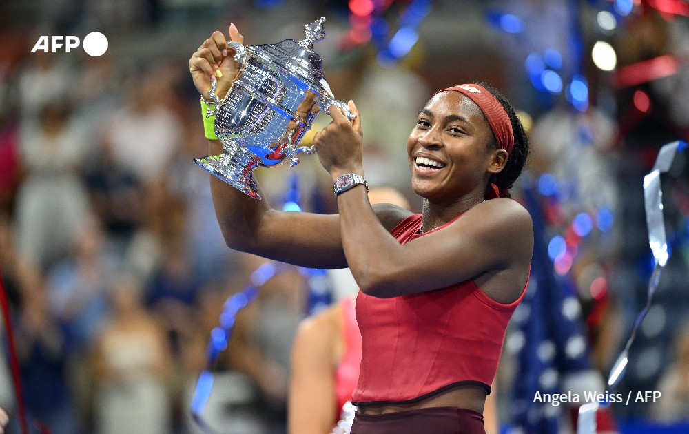 Coco Gauff poses with the trophy at the US Open tennis tournament 
